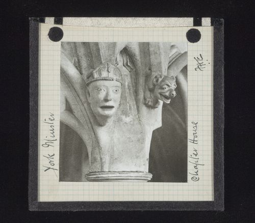 View of sculptures of man's head and grotesque head in Chapter House of York Minster, York, North Yorkshire, England