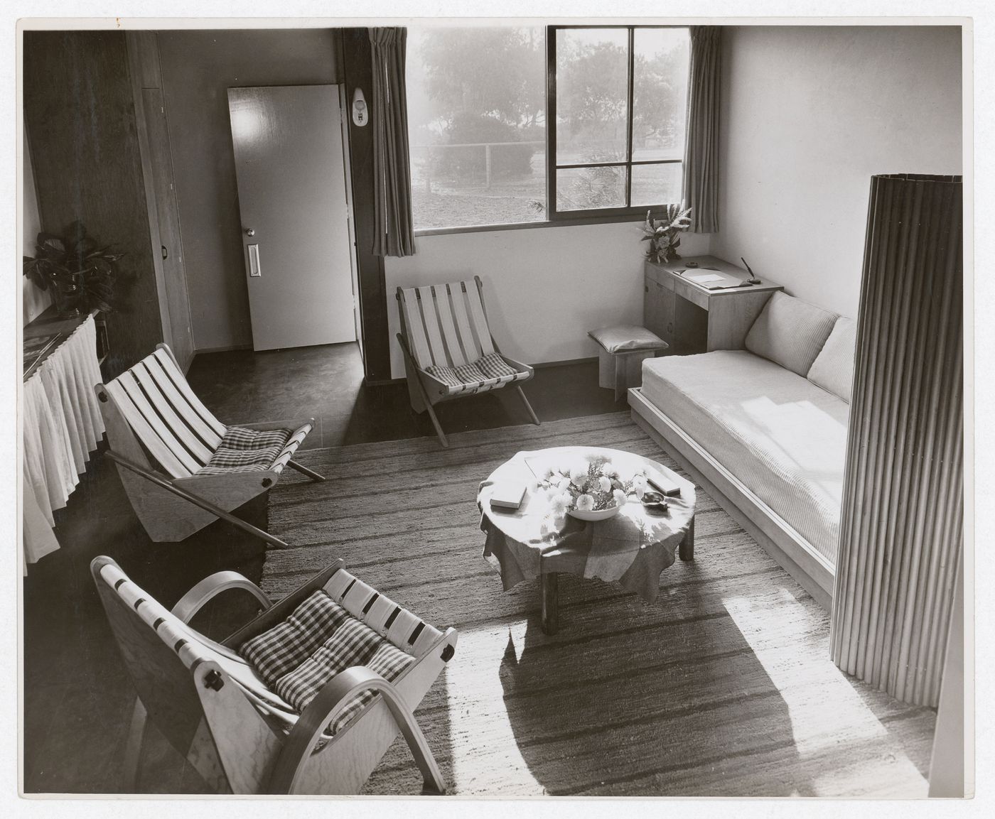 Interior view of a furnished living room in a one storey duplex
