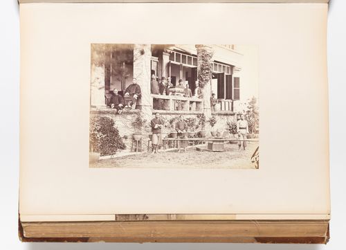 View of the veranda of a building showing men and a sedan chair, possibly Foochow (now Fuzhou), China