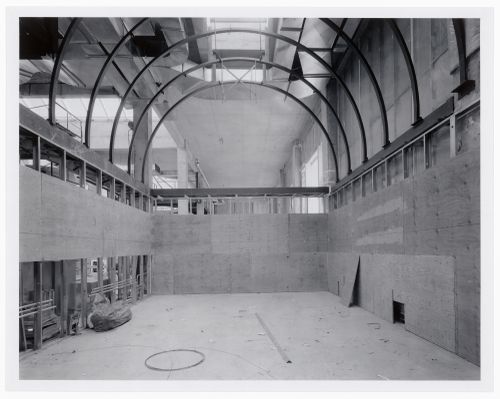 Interior view of an exhibition gallery showing space frames and walls covered with plywood, Canadian Centre for Architecture under construction, Montréal, Québec