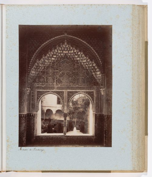 View of Moorish mullioned window overlooking Lindaraja courtyard, Alhambra, Granada, Spain
