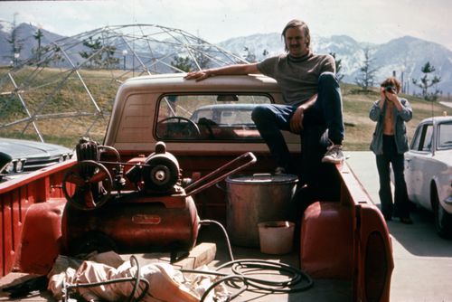 Photograph of back of truck with paint sprayer and compressor for Red Line