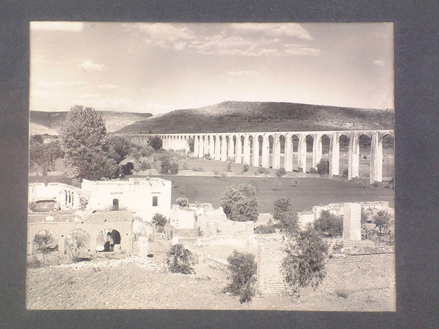 View of ruins and the aqueduct of Querétaro with hills in the background, Querétaro, Mexico