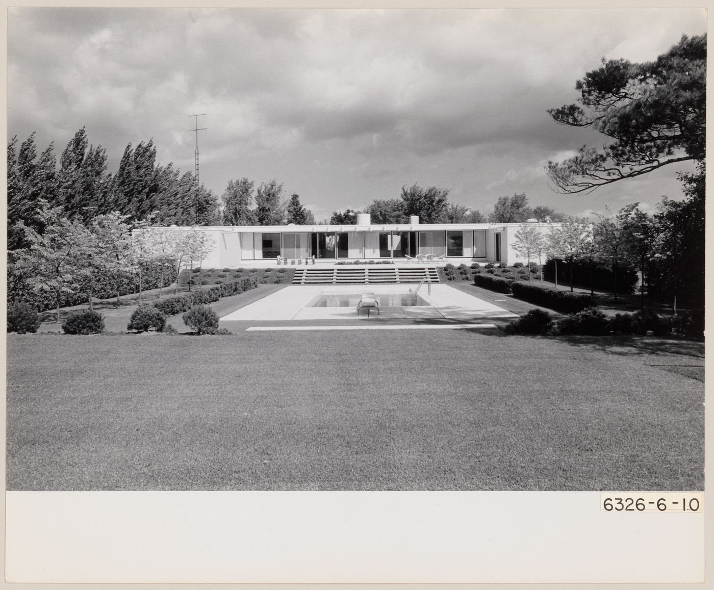 Exterior view of Parkin's residence and swimming pool at 75 The Bridle Path, North York