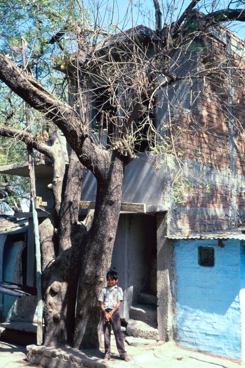 View of a house and a young child in India