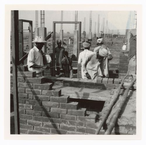 View of workers and houses under construction, Sector 22, Chandigarh, India
