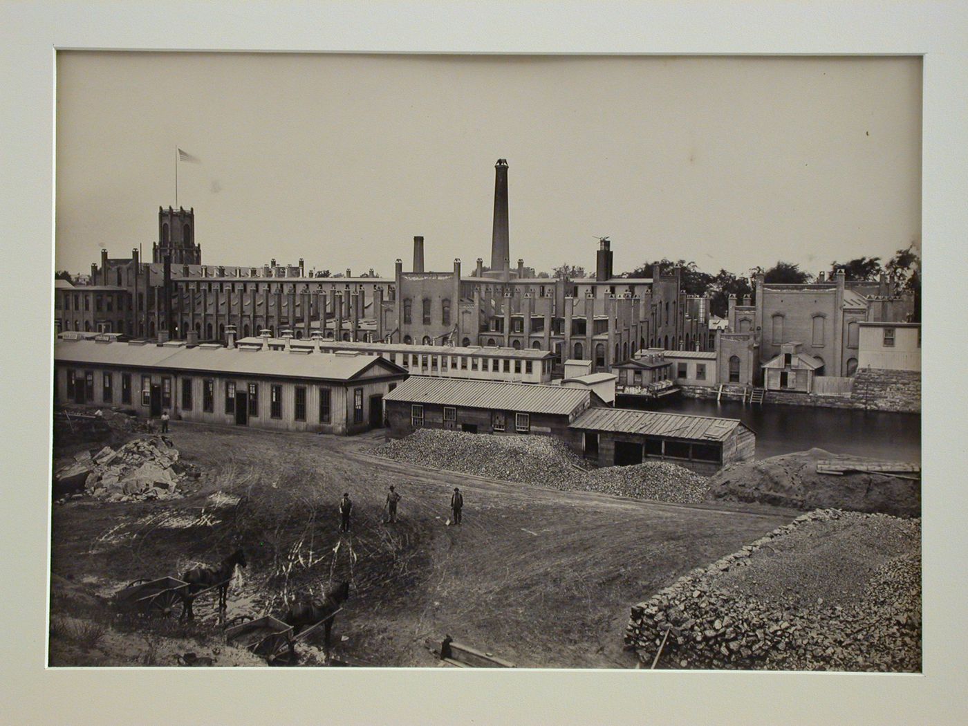 Armory, Water-shops, overview of yard and river, three workers with shovels standing, Springfield, Massachusetts