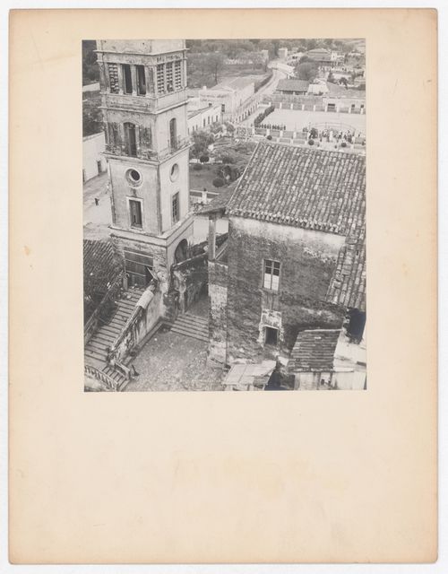 Partial view of a tower and house with an arena [?] and houses in the background, from the Catedral de Cuernavaca, Cuernavaca, Mexico