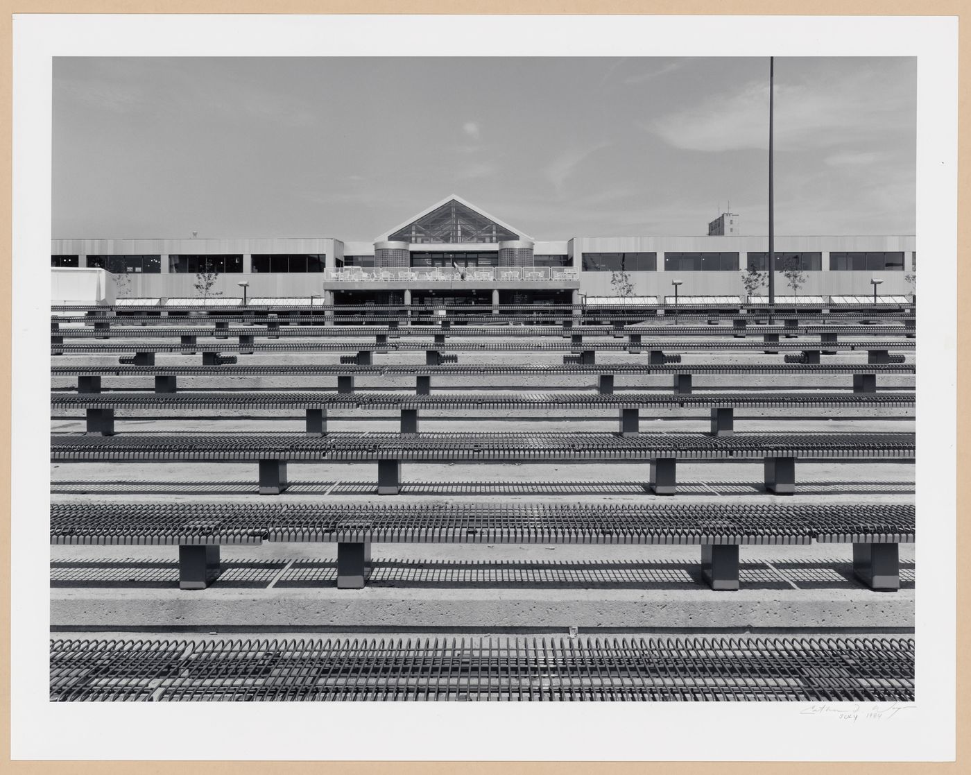 View of tiered seats at the Agora with Hangar des boutiques (now École navale des Forces canadienne) in the background, Port of Québec, Québec