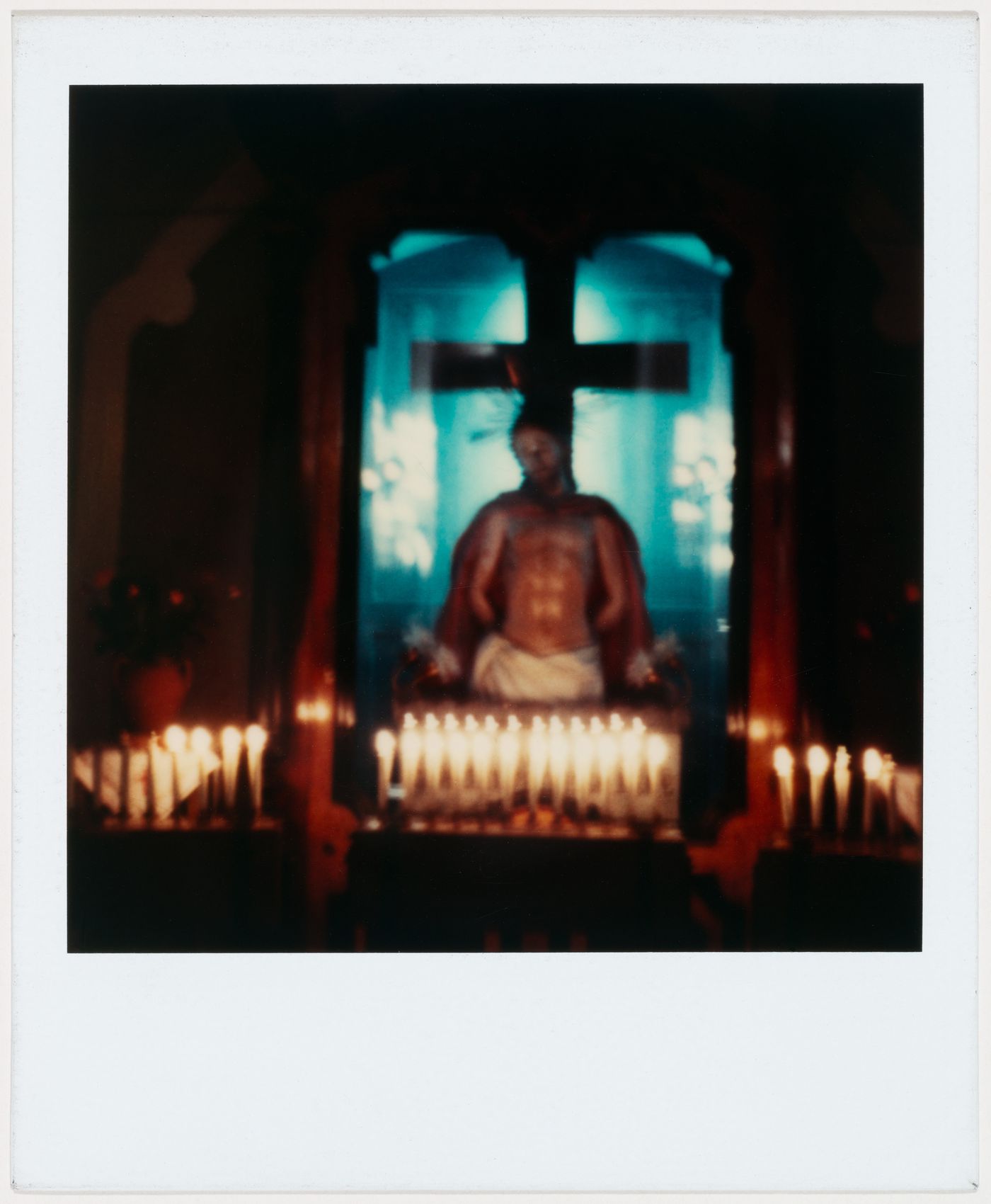 Statue of Jesus with candles
