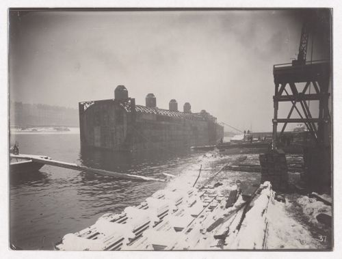 Construction of the Paris Metro, exterior view with snow, with a caisson, workers and the Seine, Paris, France