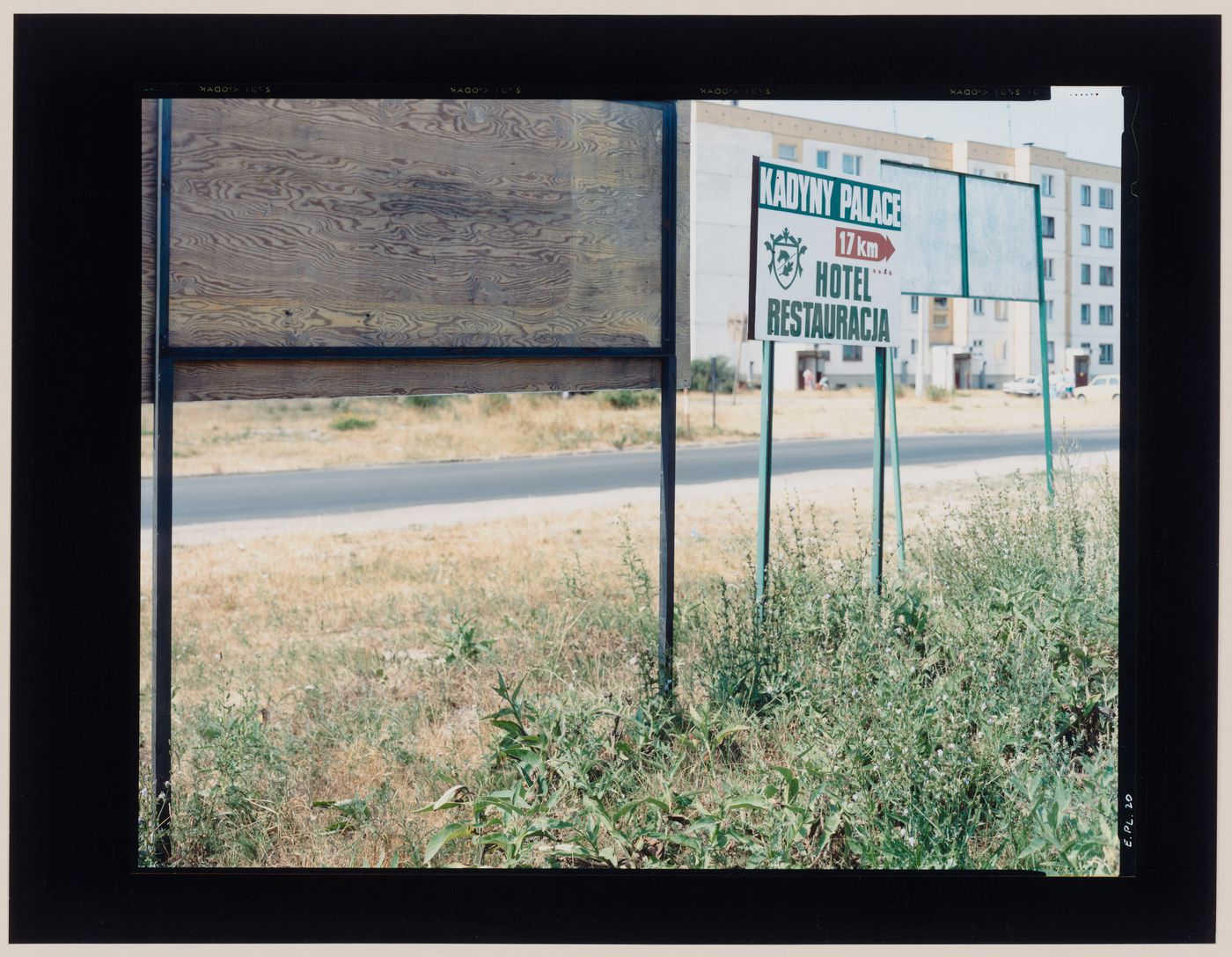 View of signs, a road and apartment buildings, Jastrowie, Poland (from the series "In between cities")