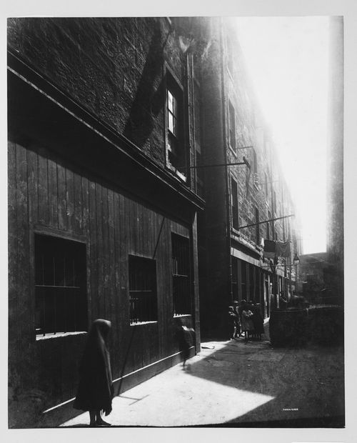 View of St. Margaret's Place showing houses with barred windows at left and a hooded figure in foreground, Glasgow, Scotland
