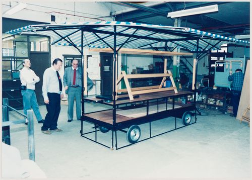 Westal: assembled market stall being inspected by Cedric Price (centre)