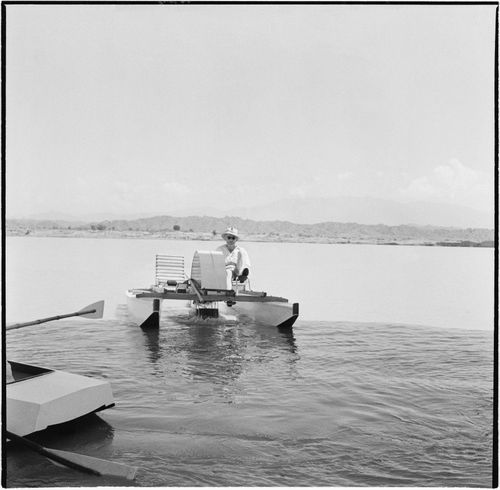 Photograph of Pierre Jeanneret on a pedal boat on the Chandigarh Lake, India