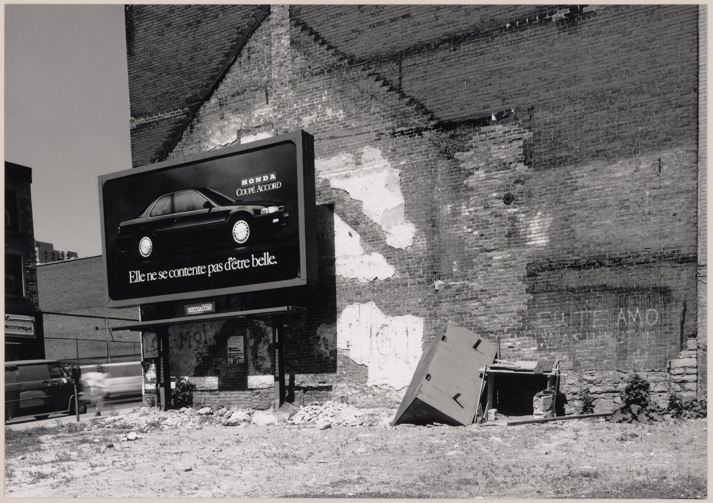 Field Work in Montreal: View of a wooden shack-like structure, refuse, a billboard, a brick wall, and a vacant lot, Montréal, Québec