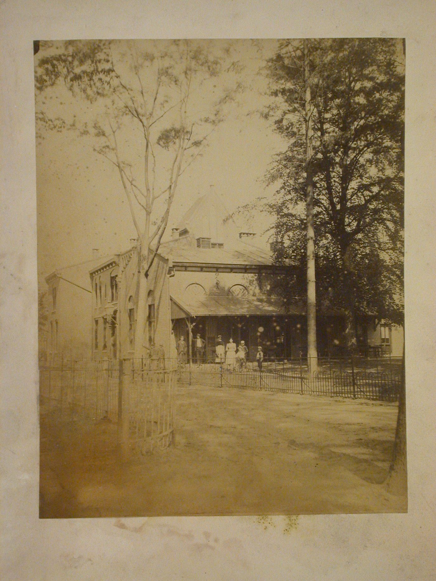 View of the principal and lateral façades of Volkshuis te Lochem [Community Centre at Lochem] from across the street, Dr. Rivestraat 3, Netherlands