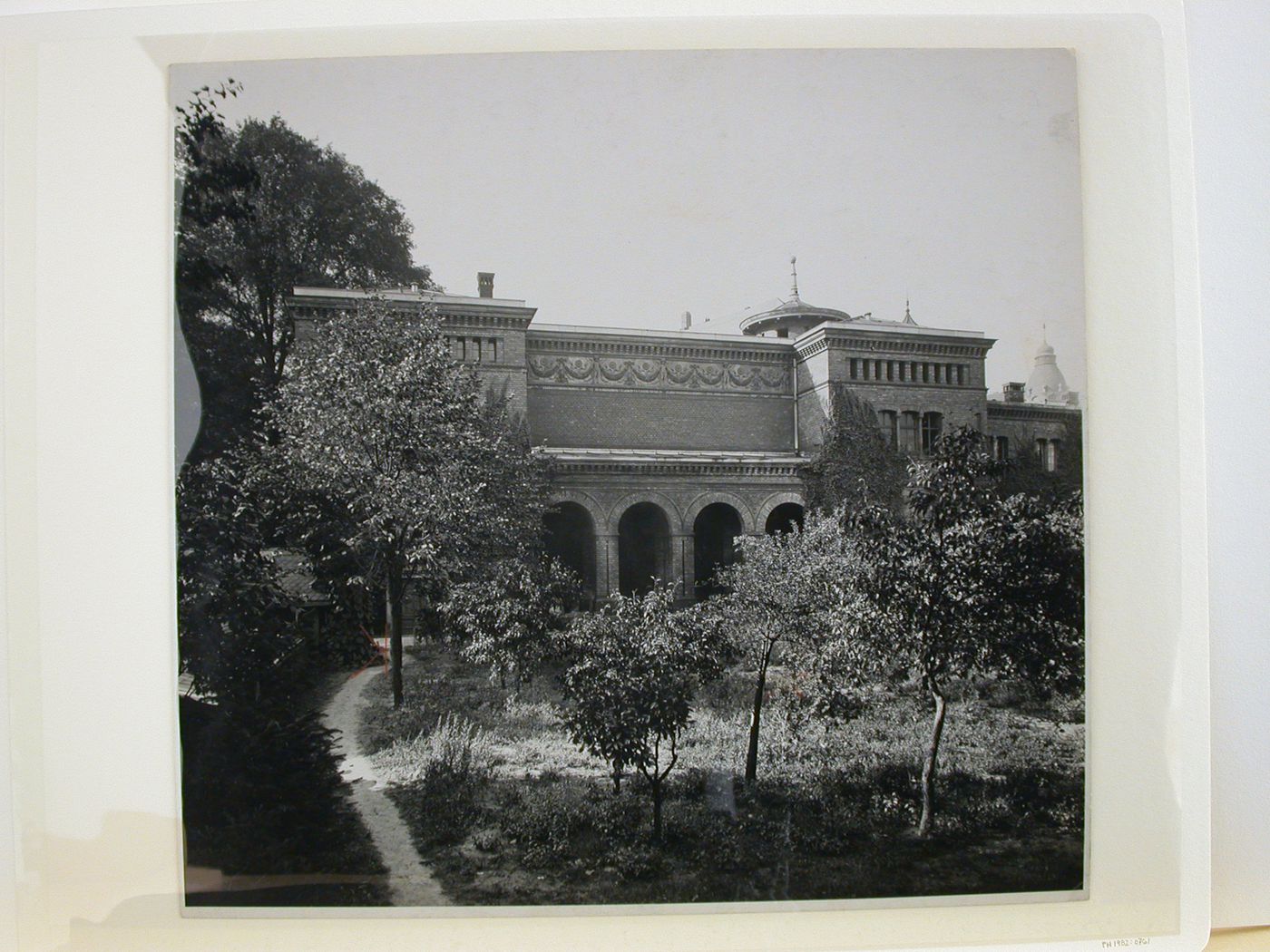 View across a garden towards the factory entrance of the August Borsig Mill [?], Moabit, Berlin, Germany