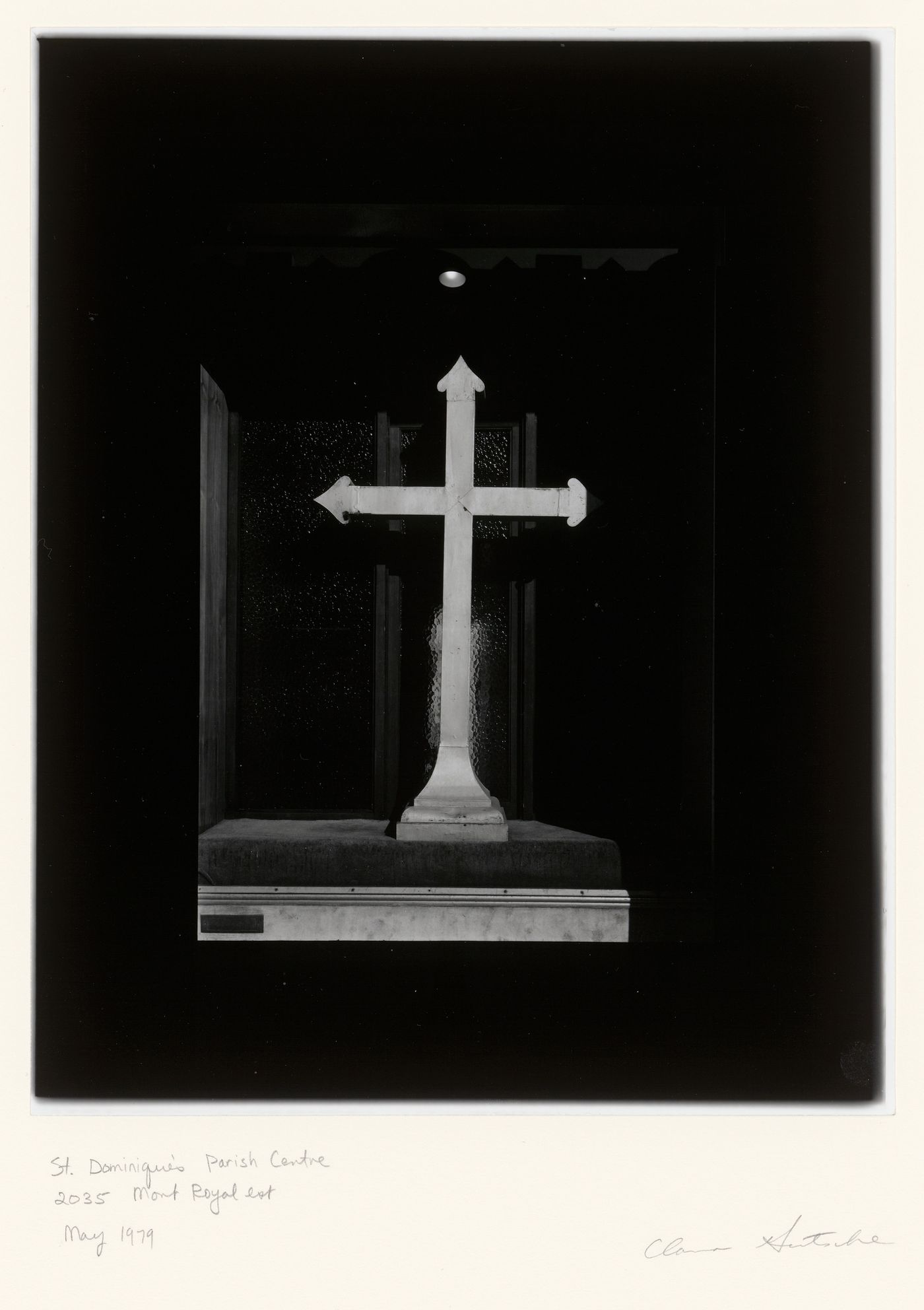 View of a window of the St. Dominique's Parish Centre (now Croque en Bol, Centre d'alimentation pour animaux) showing an altar cross, 2035 avenue du Mont-Royal Est, Montréal, Québec