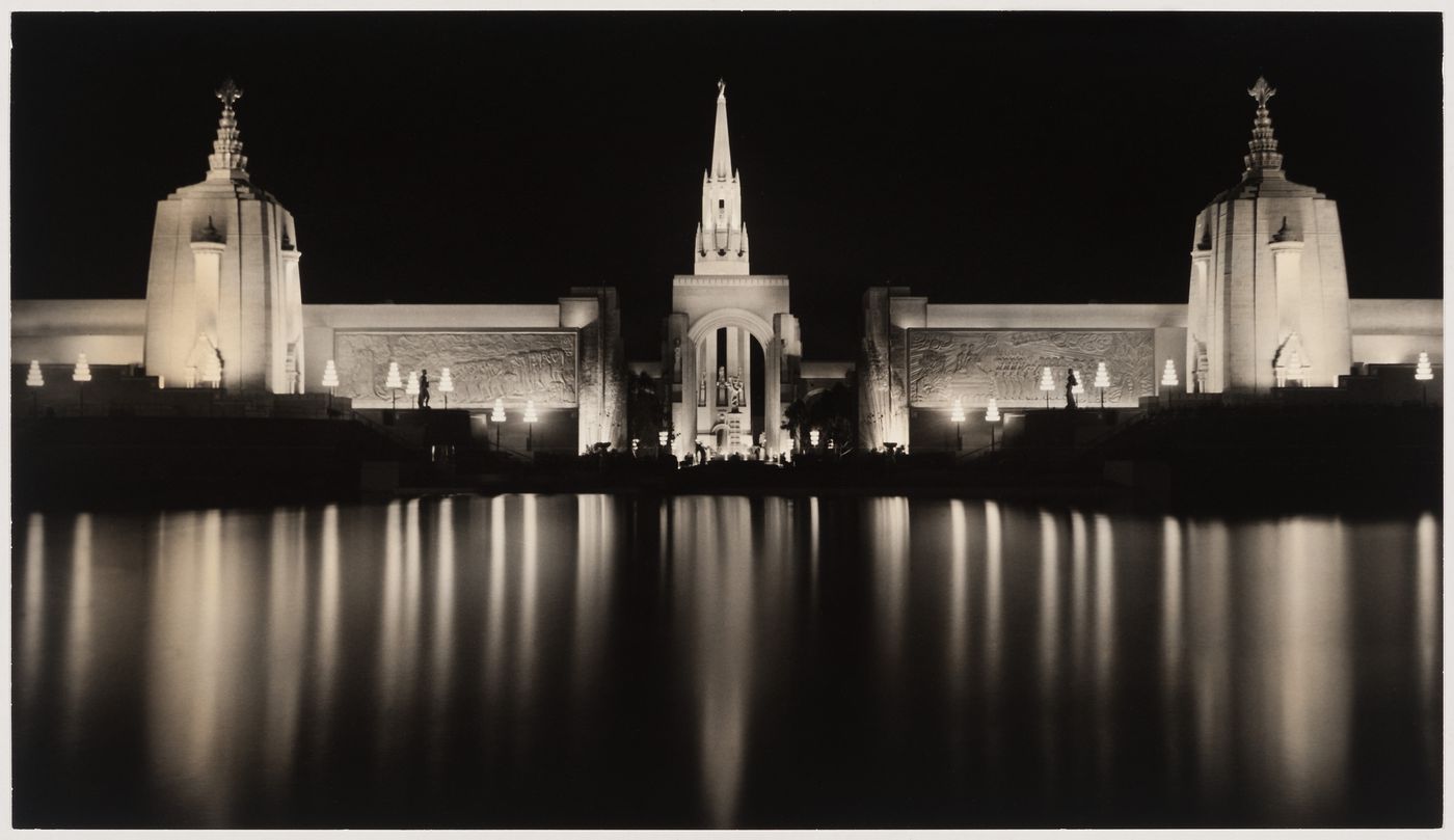 Night view across the Lake of the Nations showing the Festival Hall, Agricultural Hall, Arch of Triumph, Girl and Rainbow Fountain and the Tower of the Sun, Golden Gate International Exposition of 1939-1940, Treasure Island, San Francisco, California