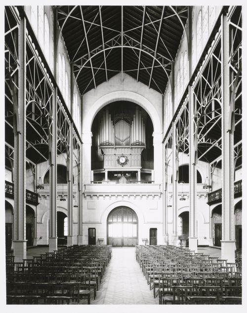 Interior view of Église Notre-Dame du Travail showing the iron structure and the organ loft above the main entrance, 36 rue Guilleminot, Paris, France