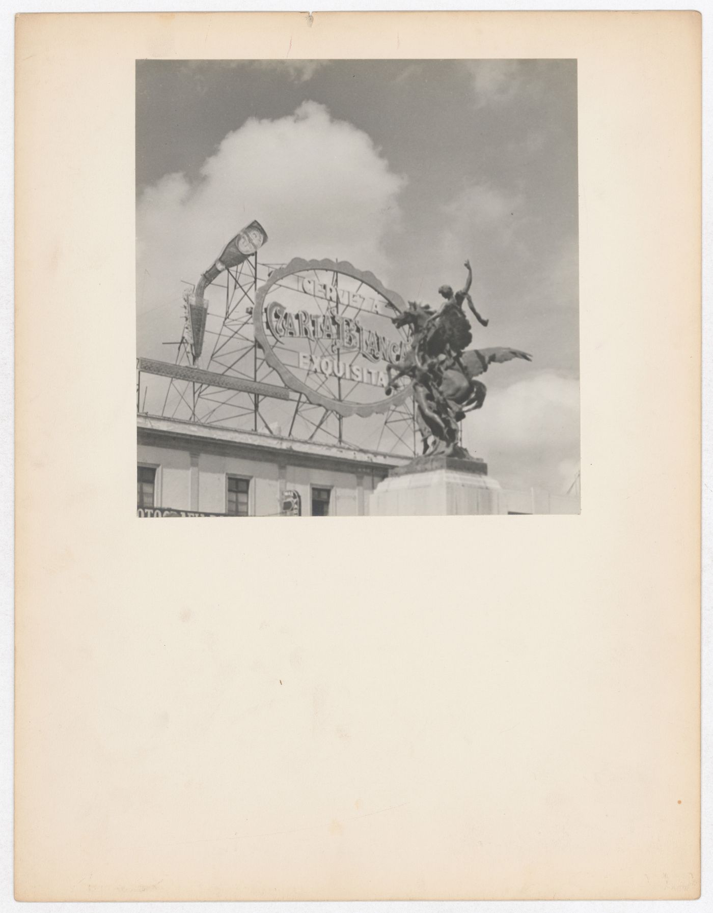 View of  a statue in the foreground and a sign in the background, in front of the Palacio de Bellas Artes, Mexico City, Mexico