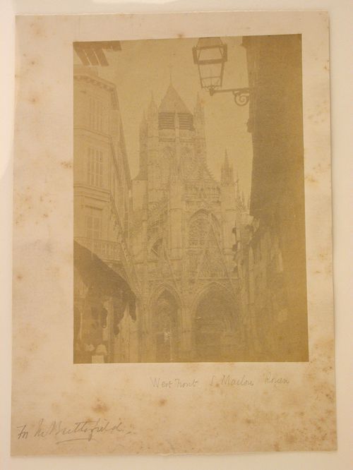 Partial view of the west façade of the Church of S. Maclou taken through a street, Rouen, France
