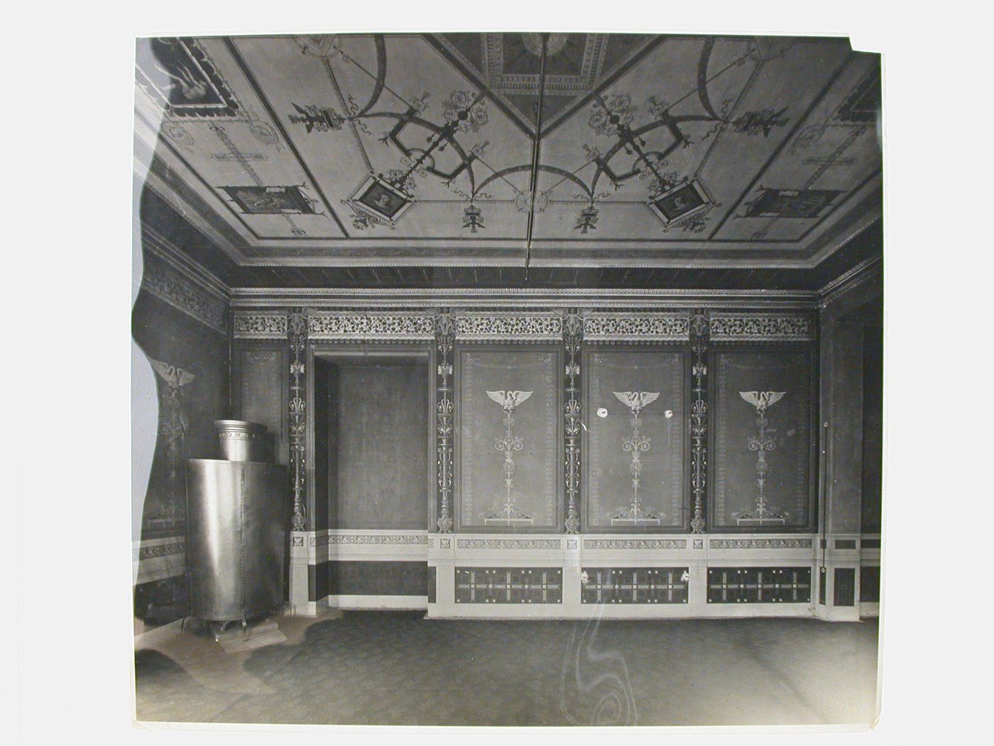 Interior view of a room in the Haus Schneider (now demolished) showing mural paintings on the walls and ceiling with a metal structure in the corner on the left, 51-53 Potsdamerstraße, Berlin, Germany