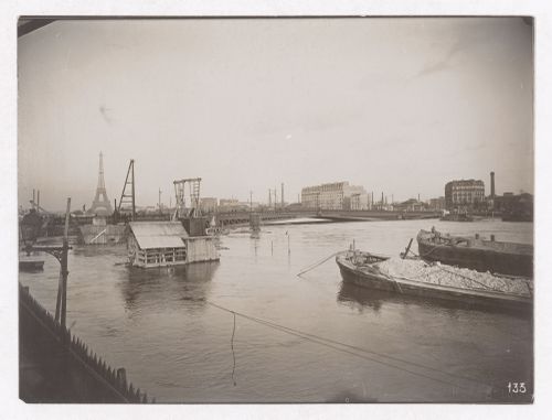 Construction of the Paris Metro, exterior view from the water with the Eiffel tower in the background, Paris, France