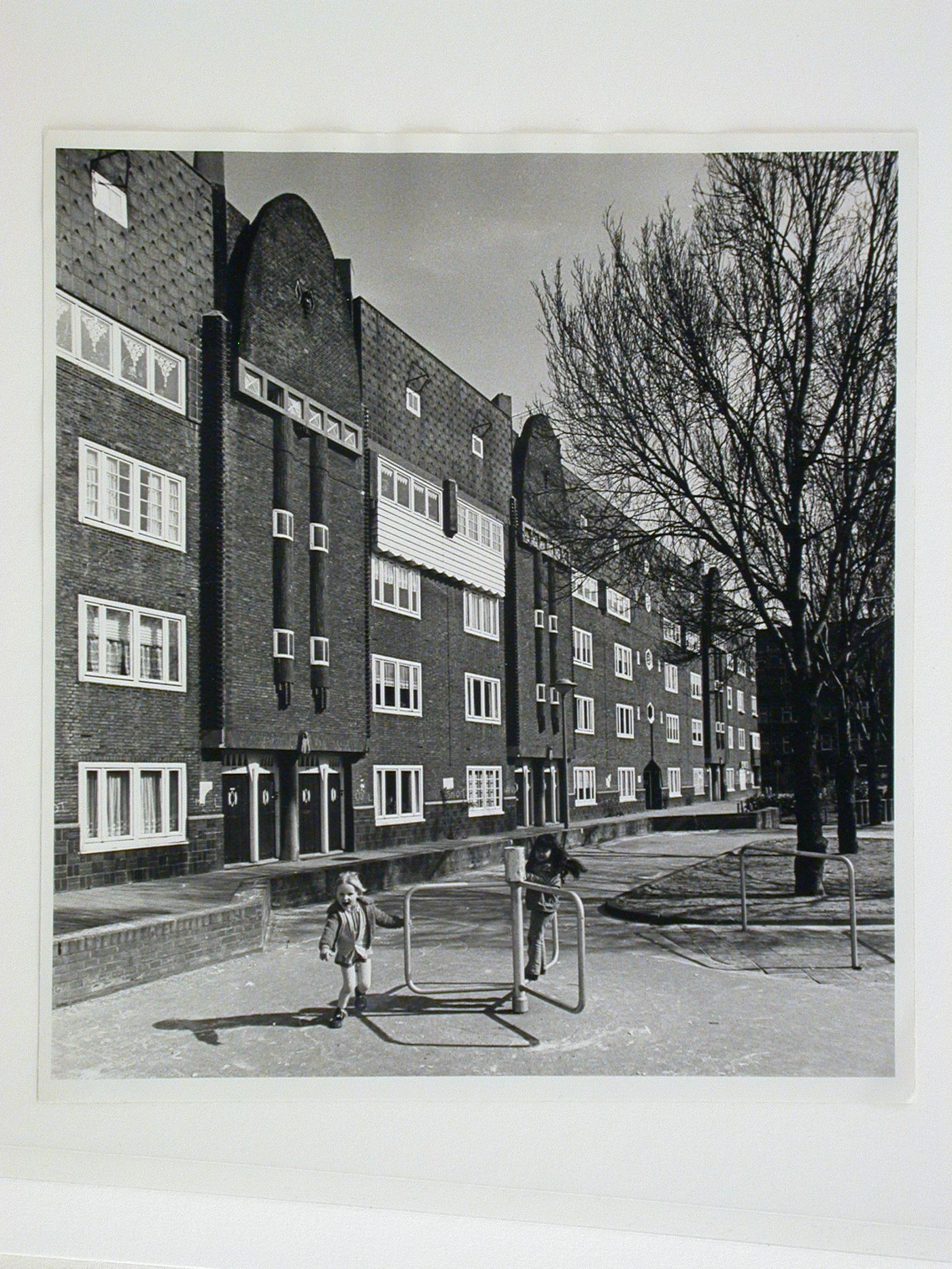 View of a façade of Block 1 with children in the foreground, Spaarndammerbuurt, Amsterdam, Netherlands