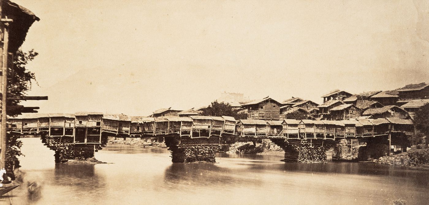 View of a bridge of houses over Ganges River [?], India