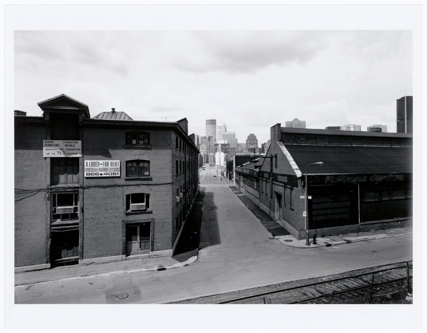 View of Smith and Peel Streets from the Canadian National Railway tracks with downtown Montréal in the background, Québec