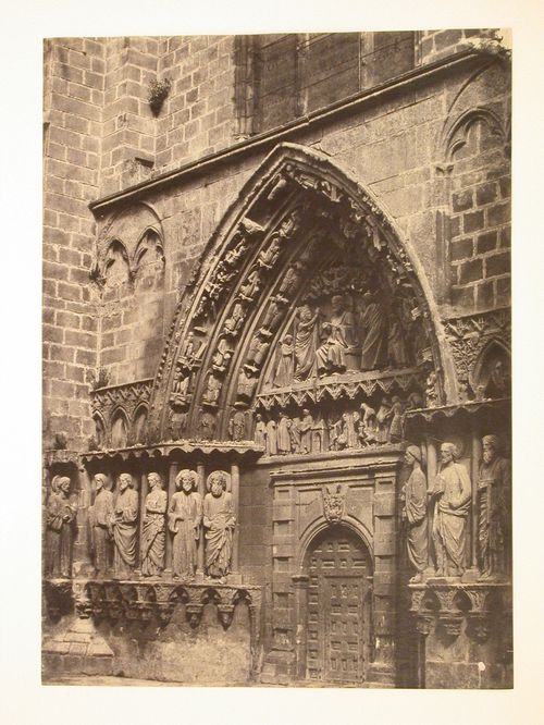 Gothic Cathedral, Gate of the Apostles, detail of door with sculpture above: tympanum, lintel and archivolts, and sculpted figures in niches on either side of door, Burgos, Spain