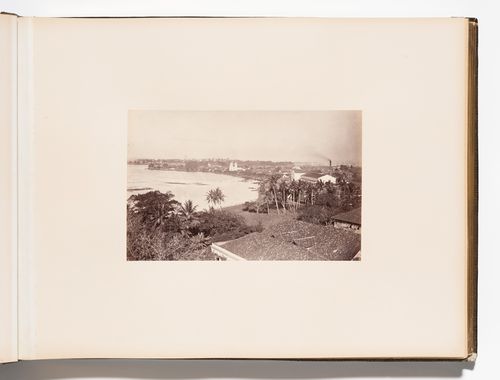 Panoramic view of Colombo showing Beira Lake and St. Philip's Church with the clock tower and lighthouse in the left background and the harbour in the right background, Colombo, Ceylon (now Sri Lanka)