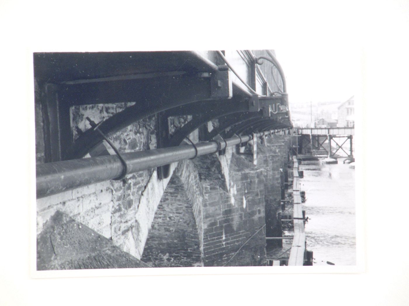 View of pipes under road of Barnstaple Long Bridge, Devon, United Kingdom