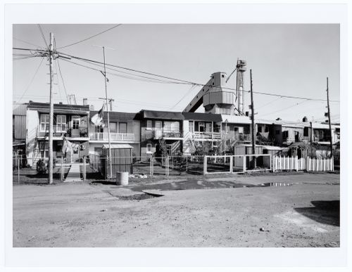 View of the lane behind St. Ambroise Street with the Francon Company Building in the background, Montréal, Québec
