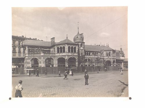 View of a building façade connecting to the elevated railway system