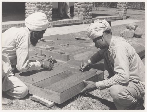 Portrait of model makers, Rattan Singh and Dhani Ram, at work on the model for Capitol Complex, Sector 1, Chandigarh, India