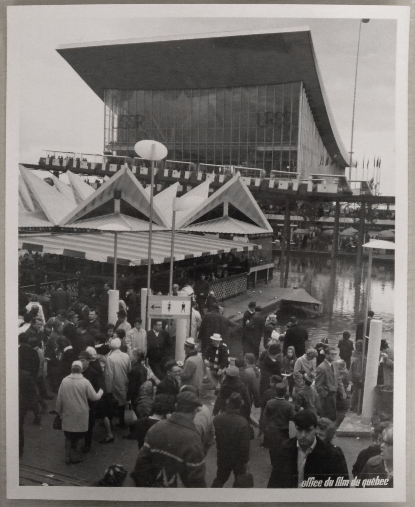 View of a terrace with the minirail and the Pavilion of the Soviet Union in background, Expo 67, Montréal, Québec
