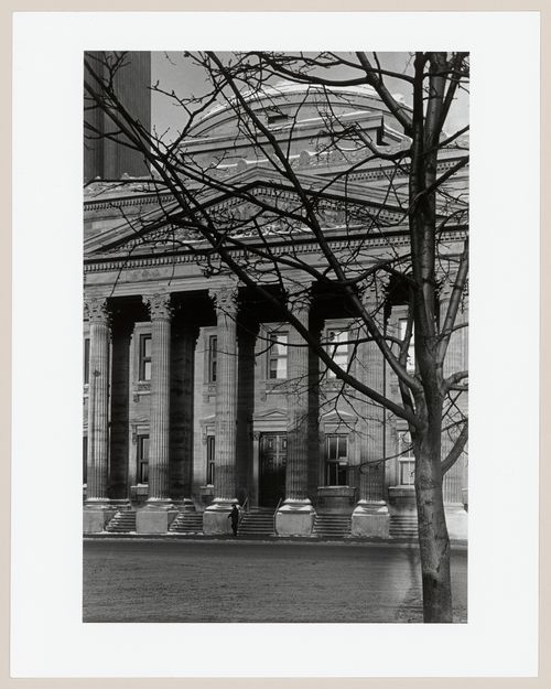 View of the principal façade of the Head Office of the Bank of Montréal from across the street after the restoration of the Corinthian capitals, 119 rue Saint-Jacques, Montréal, Québec