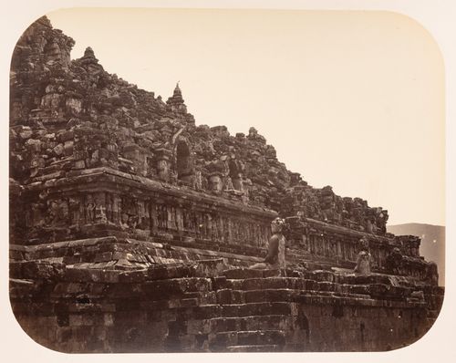 View of the central structure of Borobudur showing statues and stone blocks, Dutch East Indies (now Indonesia)