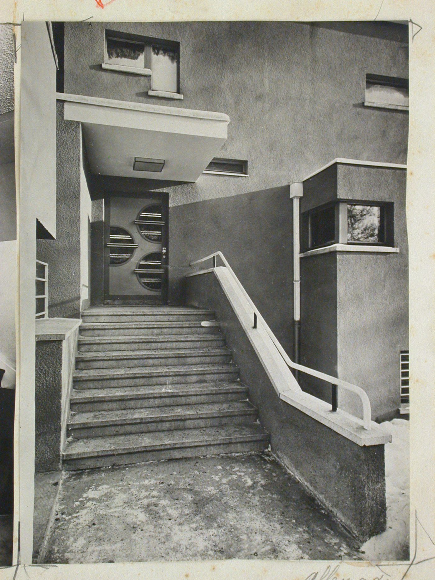 View of an exterior staircase leading to an entrance door of a villa [designed by Adolf Rading], Breslau (now Wroclaw), Poland