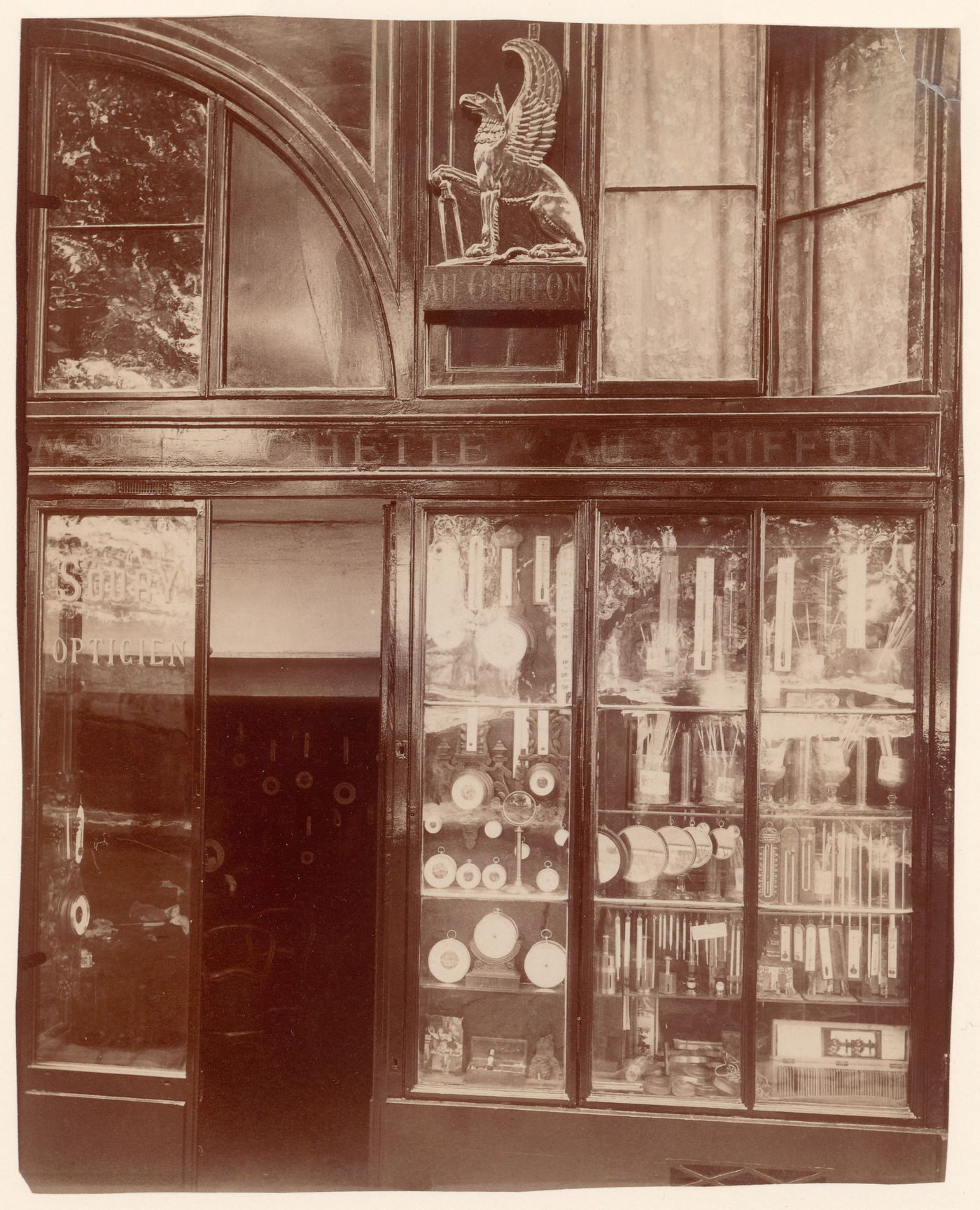 Detail of shop window with many clocks and thermometers, Paris, France
