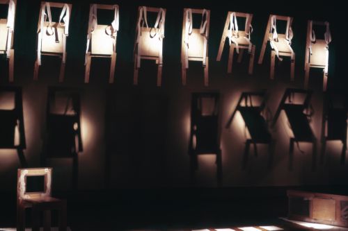 Slide of wearable chair installation at Minneapolis Institute of Art for performance Vestirsi Di Siede
