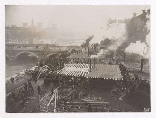 Construction of the Paris Metro, exterior view with machinery, workers and smoke coming out of smoke stacks, Paris, France