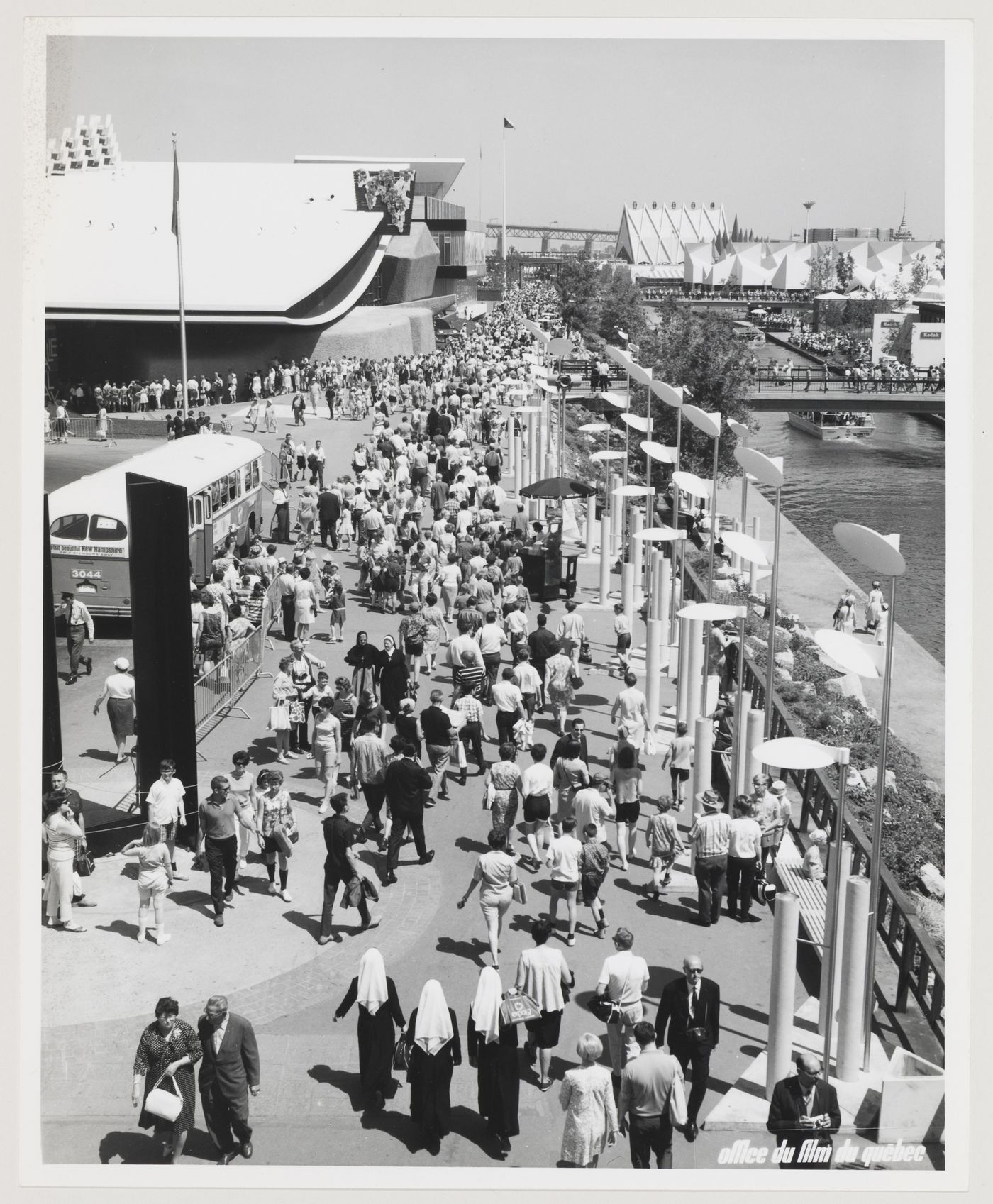 View of a walkway with the Pavilion of Italy on the left, the Africa Place on the right and the Steel Pavilion in background, Expo 67, Montréal, Québec