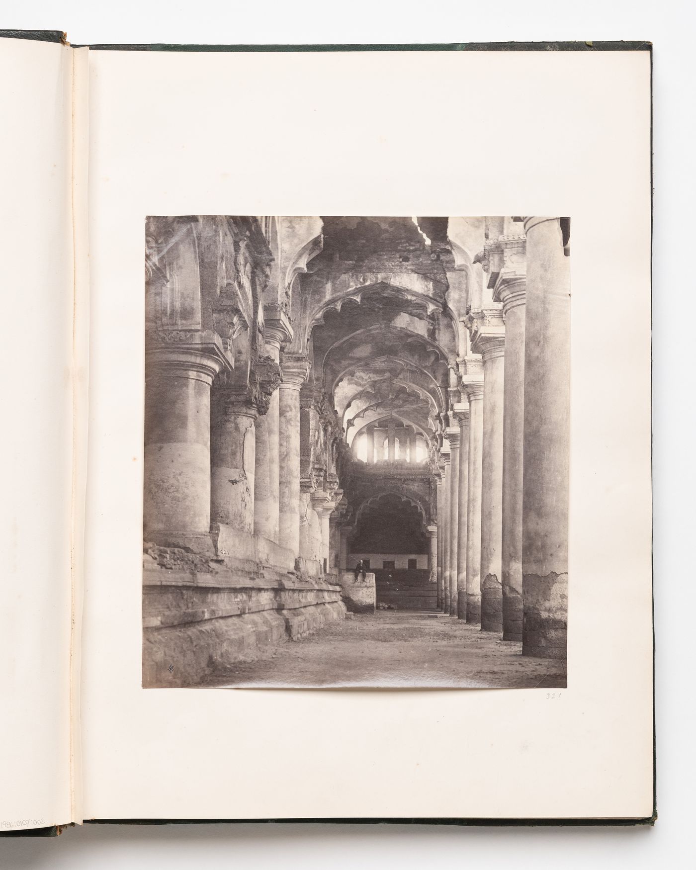 View of an arched aisle inside the Durbar Hall of the Thirumalai Nayaka Palace complex, Madura (now Madurai), India