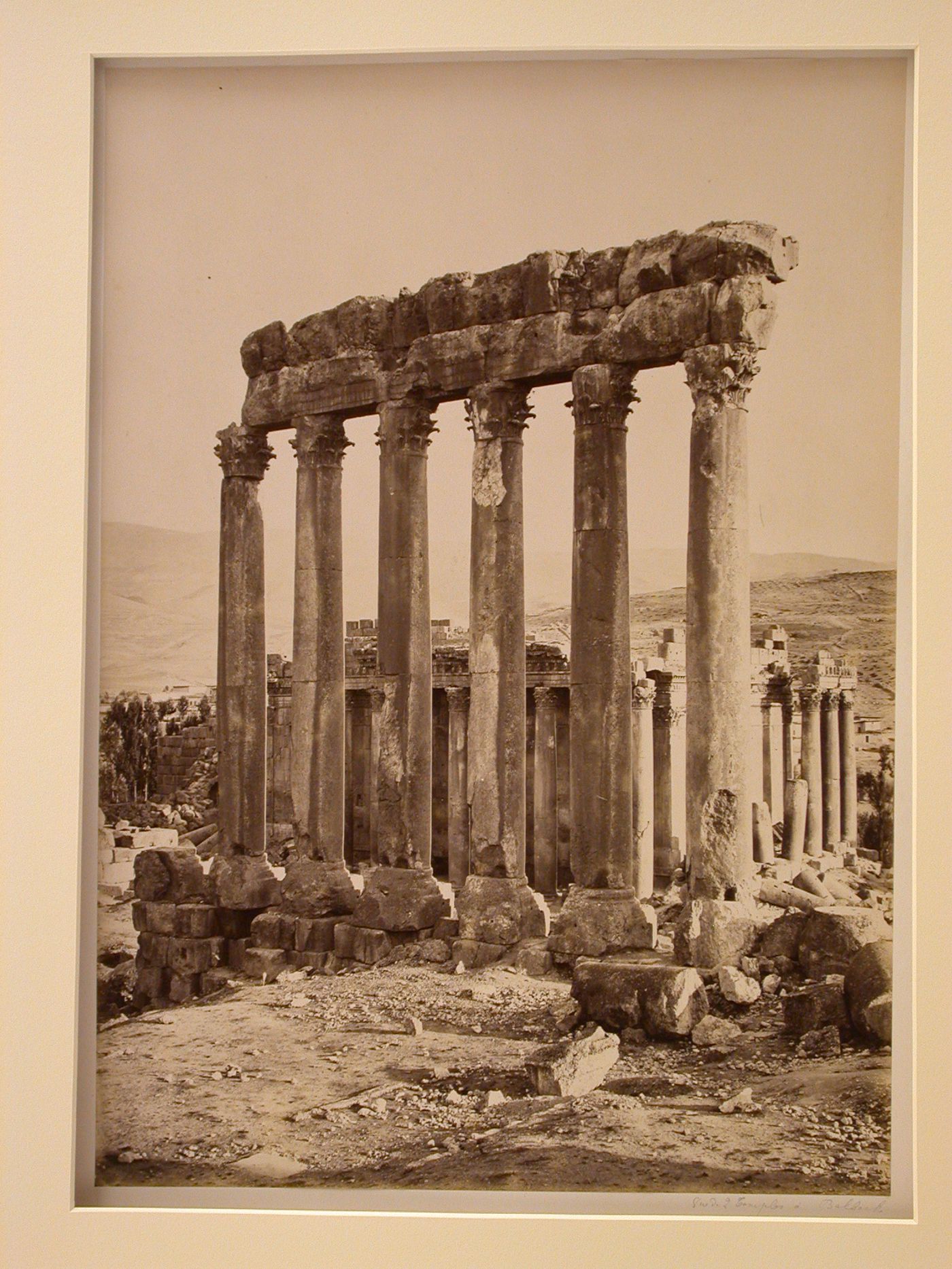 Temple of Jupiter Heliopolitanus remaining columns of southern colonnade rear view and Temple of Bacchus, northeast portion, Balabaakk, Lebanon