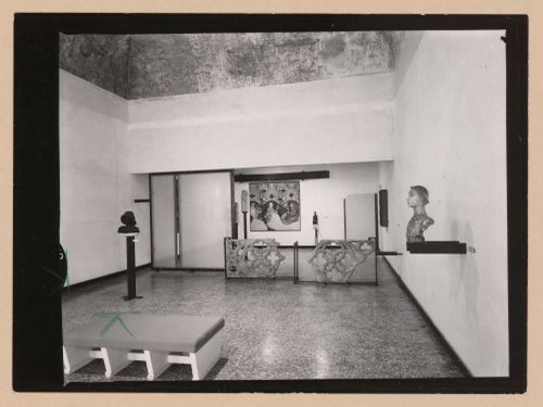 Interior view of a gallery showing a bench, fragments of stone tracery and a painting, Museo Correr, Venice, Italy