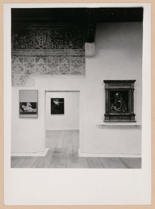 Interior view of a gallery showing paintings, a fresco, a doorway and another gallery, Museo di Castelvecchio, Verona, Italy